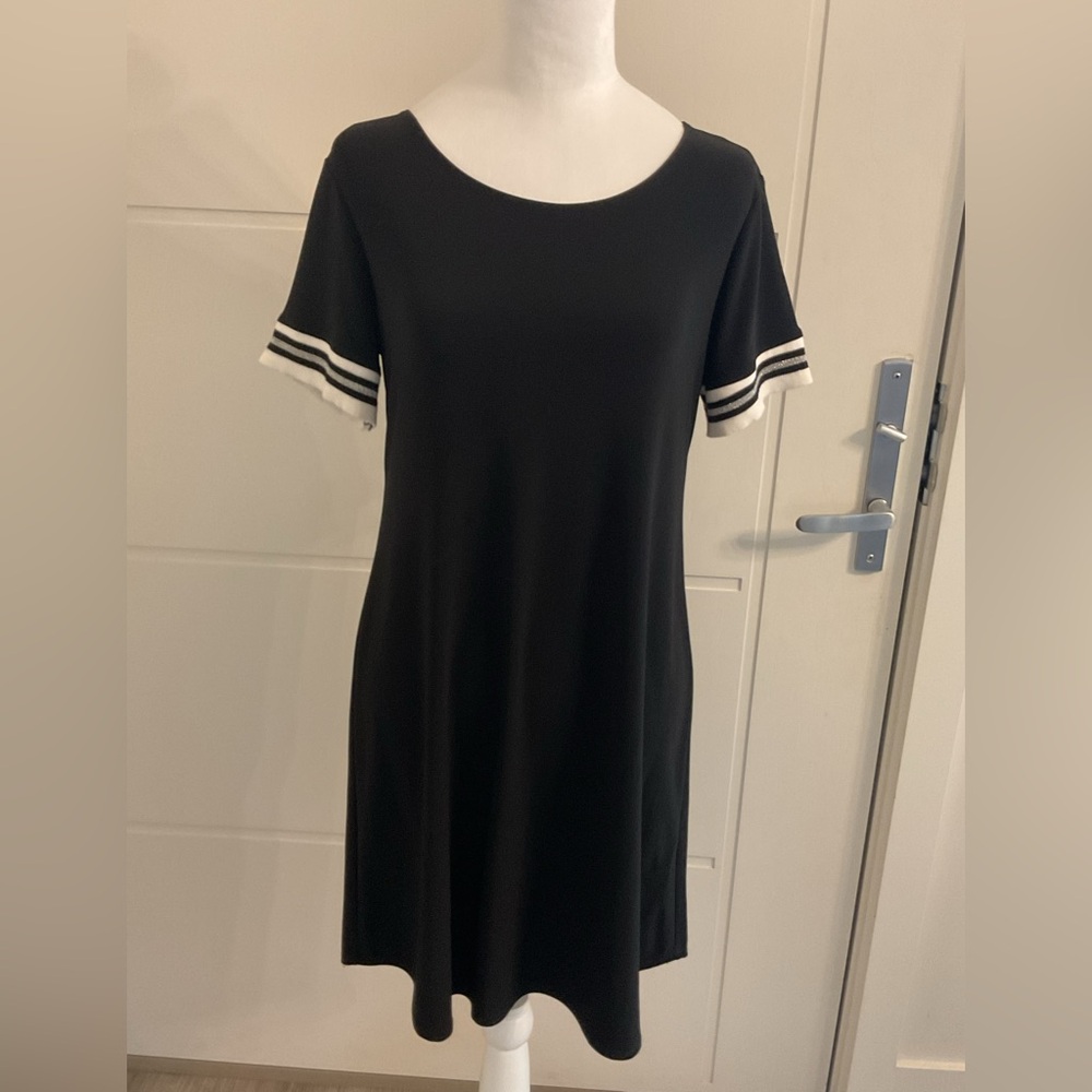 Laura Petite Baseball Dress  black dress with rounded hemline .